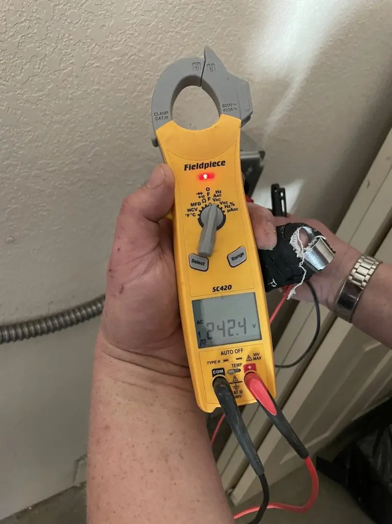 Voltage testing with clamp meter during Electrical Installation Services in New Castle